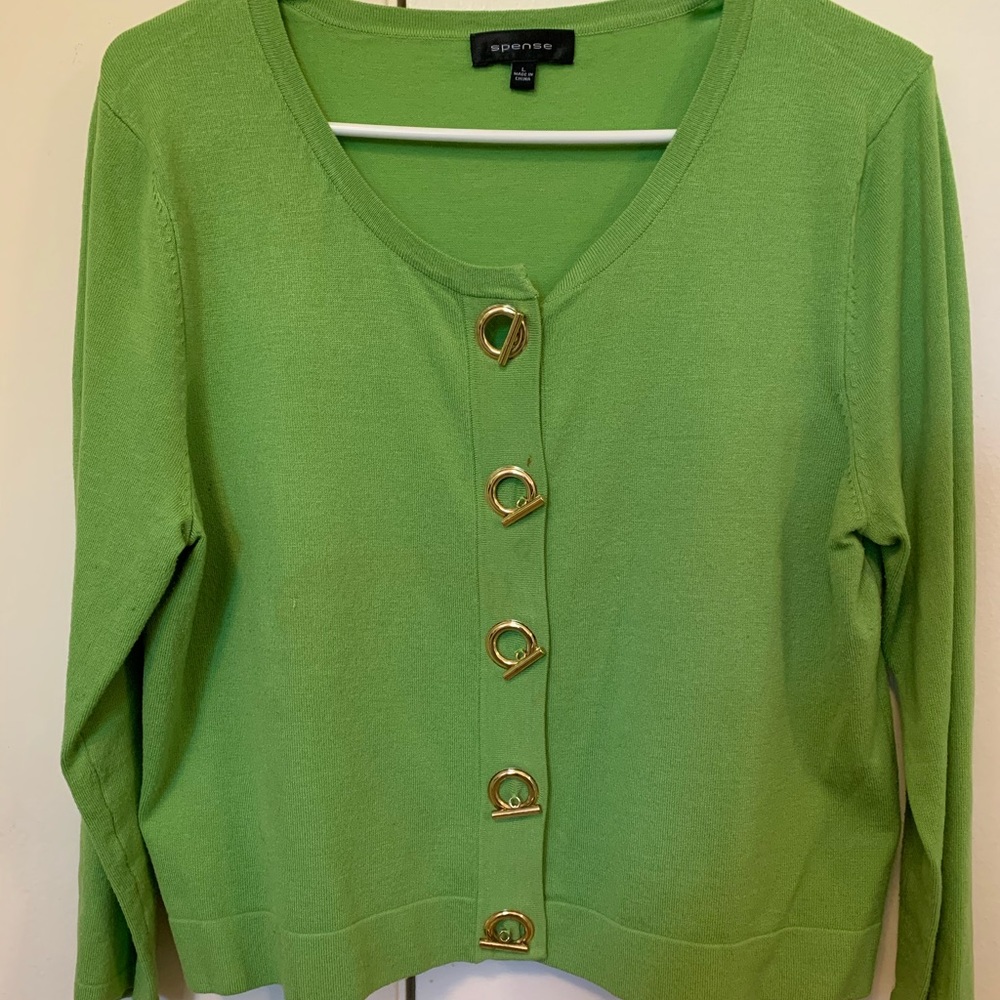 Lime green cardigan w/ accent buttons.